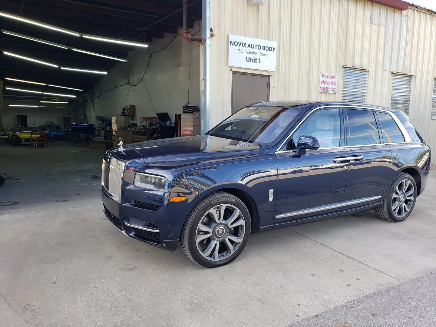 Rolls-Royce Cullinan outside the Novix Autobody shop